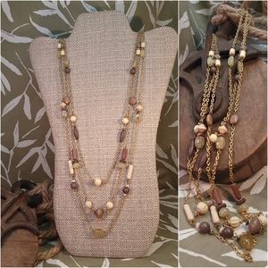 Multi stranded neutral colored necklace
